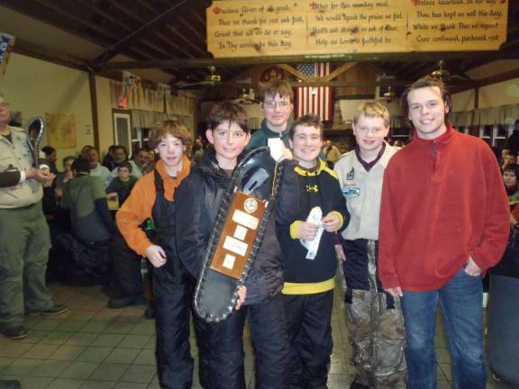Troop 84 attends Klondike Derby The third-place sled team is presented with its trophy.