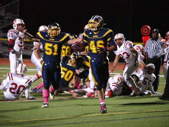Vikings' rally falls short against Morris Hills Vernon offensive guard Nicholas Rapisardi (51) raises his arms in excitement after running back Ken Artsma (46) scores the Vikings' first touchdown in the second quarter.