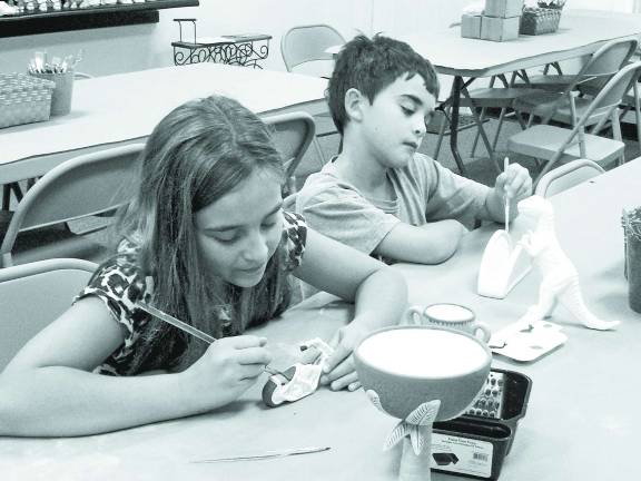 From mudpies to monsters at new pottery studio Photos by Don Carswell Nicole and Jayden Humphris show their artistry.
