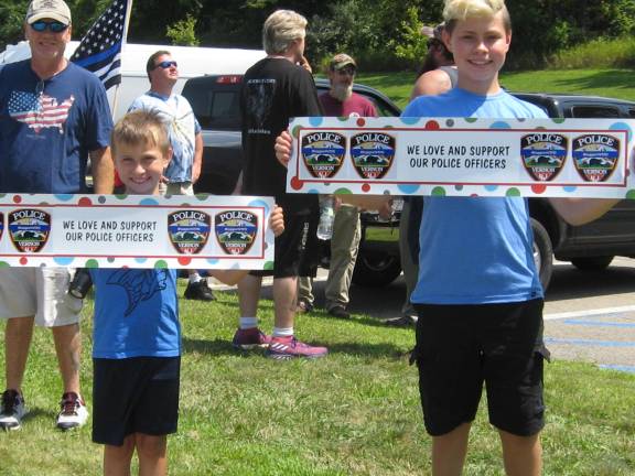 Brothers Luke and James also attended the August 3 protest.