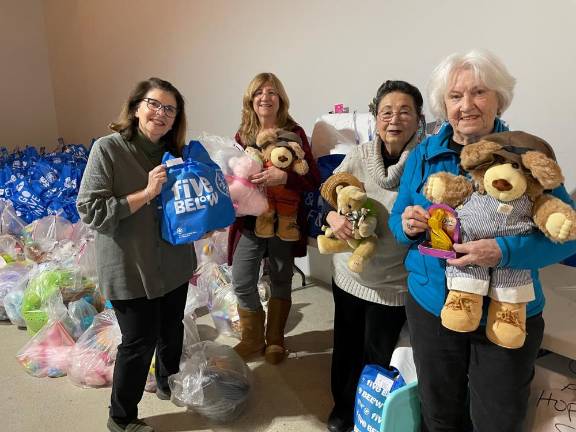 Woman’s Club members, from left, MJ Palmer, Karen Rothstadt, Cathy Weeks and Barbara Pfeifer