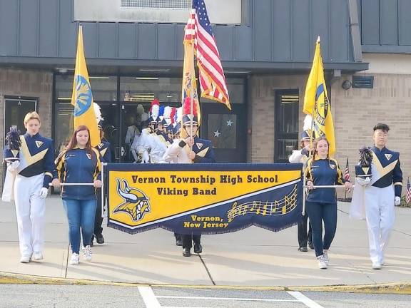 Vernon High School Band leads the Veterans Day Parade at Cedar Mountain Primary School.