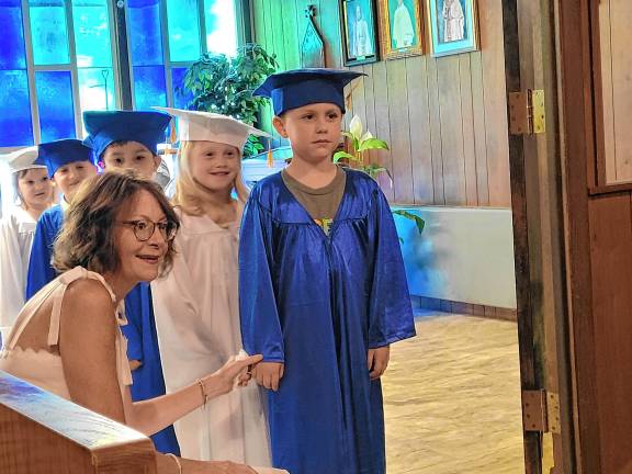 Preschool’s last graduation Hunter Rios, 5, is the next Our Savior Nursery School graduate to walk into the ceremony June 6. (Photos by Theresa Esposito)
