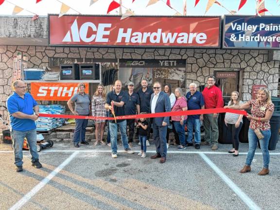 Ace Hardware reopens <b>Martin O’Donnell, left, and Stephanie Scilingo of the Vernon Chamber of Commerce hold a ribbon as Dave Ferguson cut it at the reopening of Ace Hardware in Vernon on Friday, Sept. 13. From left are Jackie Vitiello, Caroline Ferguson, Don Ferguson, Don Ferguson Jr., Mayor Anthony Rossi, Laura Ferguson, Debbie and Bo Ferguson, Ace district manager Scott Schneider and Marissa Rossi. (Photo provided)</b>