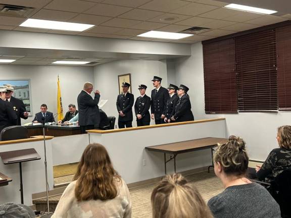 Mayor Robert Holowach administers the oath of office to Sussex Borough fire officials.