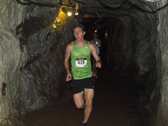 PHOTOS BY JOHN CHURCH Kevin Good of Franklin runs through the Sterling Hill Mine Saturday morning.