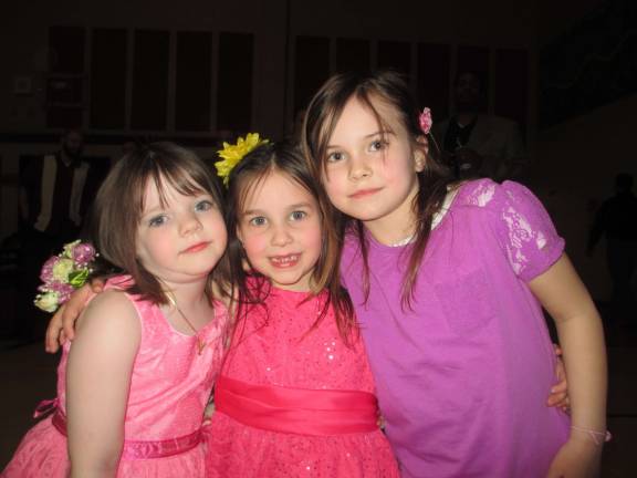 From left, Abby Lanza, Juliana Johnson and Jordyn Faber, all 6, are shown at the Father Daughter Dance.