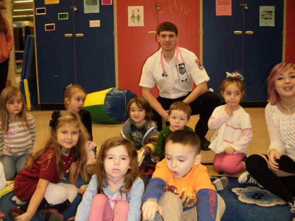 Vernon Township First Aid Volunteer Nick Colao talked to the preschool children that attend a program run by his Child Development course at Vernon Twp. High School. He explained how EMS workers help people in emergencies.