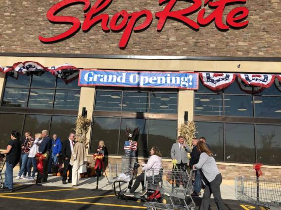 Shoppers line up to enter the new store. (Photo by Kathy Shwiff)