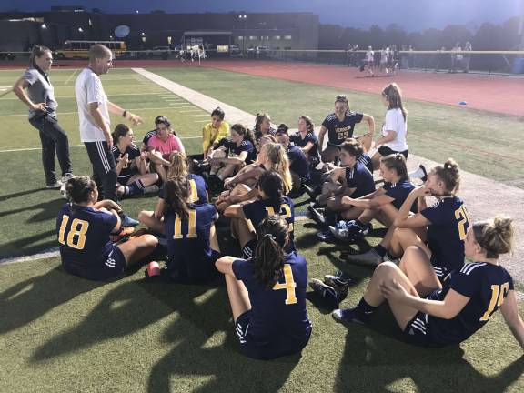 Coach Carlson addresses the girls following their 6-0 win over Lenape Valley on Girls Soccer Youth Night.