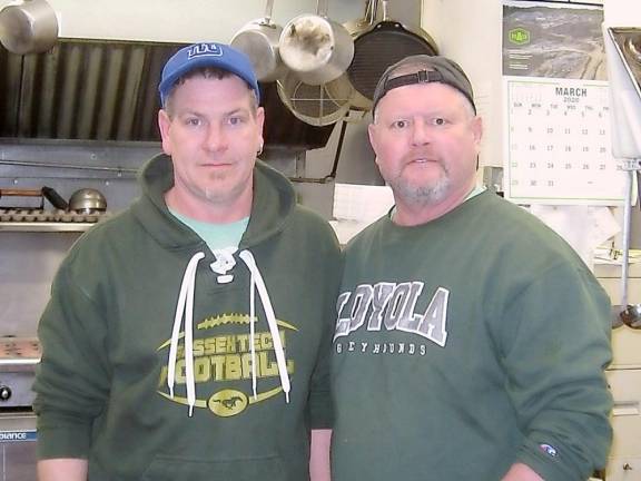 Tracks Deli owners Scott and Kevin are busy satisfying deli customers and helping Vernon stay strong.
