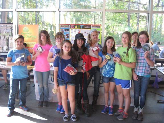 Girl Scouts do good deeds Photo provided Girl Scouts from Troop 70994 High Point Service Unit pose with “fly bonnets” which they donated to the therapeutic riding horses at GAIT TRC. The scouts helped raise $300 for GAIT with a bake sale at the PEEC Harvest Festival.