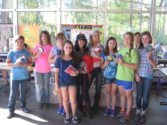 Photo provided Girl Scouts from Troop 70994 High Point Service Unit pose with &#x201c;fly bonnets&#x201d; which they donated to the therapeutic riding horses at GAIT TRC. The scouts helped raise $300 for GAIT with a bake sale at the PEEC Harvest Festival.