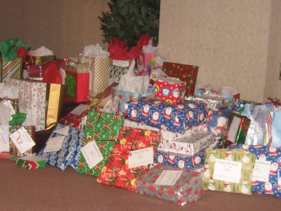 PHOTOS BY JANET REDYKE St Francis de Sales Church again this year collected gifts for area needy families.