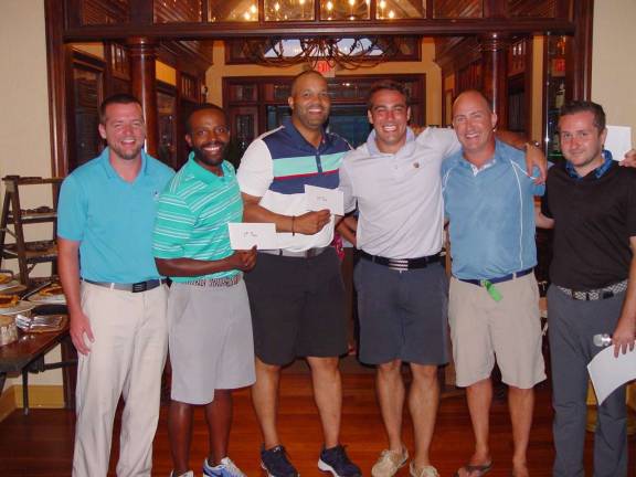 The winning team of Michael Korn, Darara Dibabu, Hommy Almonte &amp; Tanner Federico receive their awards from Event Coordinator Ryan Donley &amp; GM Mark Melillo.