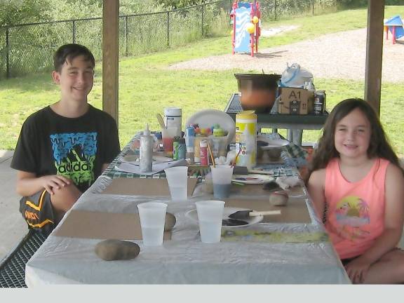 Brother and sister Matt and Zoey completed their sidewalk art and worked on rock painting (Photo by Janet Redyke)