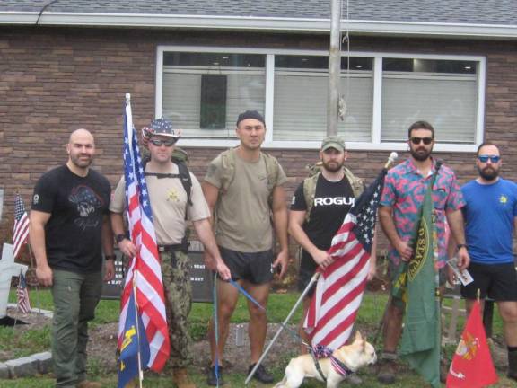 Members of the Veterans Day Wallkill Valley VFW ruck march finish their honor march at the post.