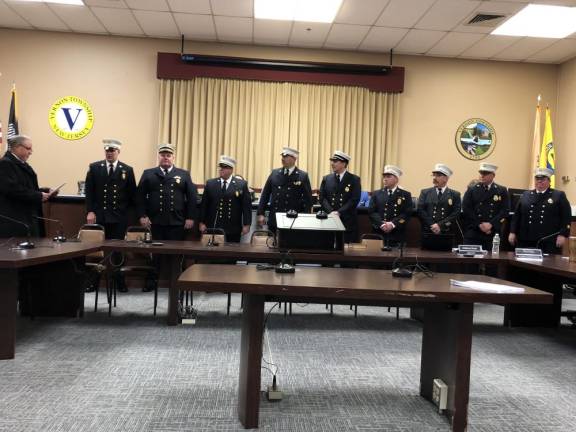 State Sen. Parker Space, left, administers the oath of office to leaders of the Vernon Volunteer Fire Department.