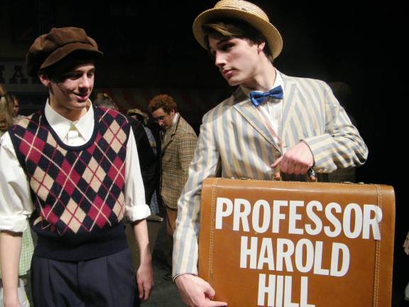 Photo by Viktoria-Leigh Wagner Kyle Pitts, who plays Professor Harold Hill, left, is shown with Ethan Kimball, who plays Hill's sidekick, Marcellus Washburn.