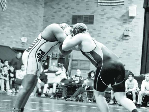 Sparta pins loss on Pope John Pope John's Noa Merritt and Sparta's Jake Vogal are locked in combat.
