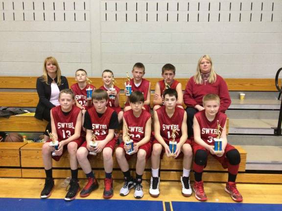 The Sussex-Wantage boys travel basketball team is bottom, from left, Connor Milks, Nick Rittweger, Bryce Dunn, Will Mason and Connor Lake; and top from left, assistant Julie Finnerty, Kevin Scymanski, Joey Finnerty, Travis Tallamy, Frankie Schomp and Head Coach Betty Scymanski.