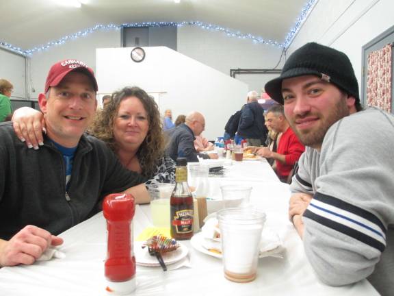 From left, Michael Huron of Branchville, Judy Stickle of Wantage and Jason Vidal of Wantage have dinner in support of the Wantage first aid squad.