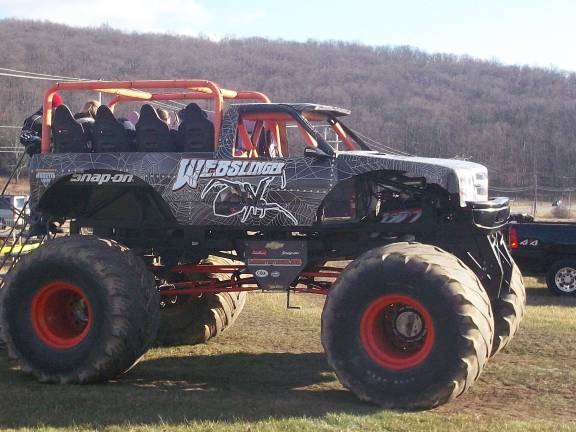 Monster Truck rides offered in exchange of gifts for the needy Monster truck rides were offered in exchange for those donating gifts and money.