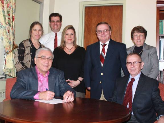 SCCC signs articulation agreements with two universities Seated from left: Dr. Paul Mazur, SCCC president, William Waite, interim vice president of Academic Affairs; standing from left: Naomi Miller, professor of psychology, chairwoman of Department of Social Sciences, coordinator of Human Services Program; Peter Schoch, interim dean of business, math, science and law; Kathleen Okay, interim dean of liberal arts, social science and education; Robert Reeber, assistant professor of computer information systems; Alberta Jaeger, assistant dean of academic affairs.