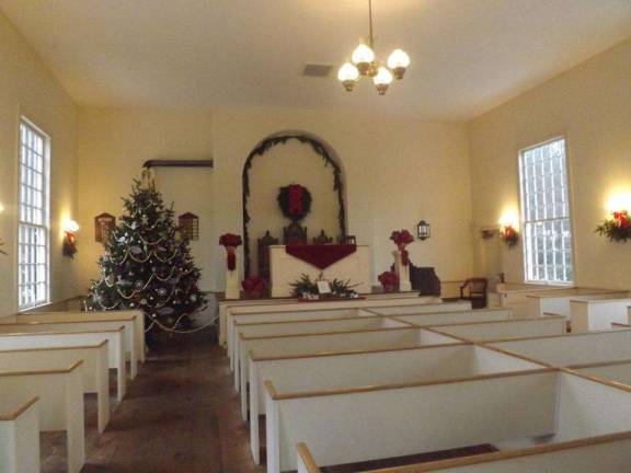 A Christmas carol service will be offered in the Millbrook Village Church, pictured here decorated for the holidays (Photo: Delaware Water Gap National Recreation Area Facebook page)