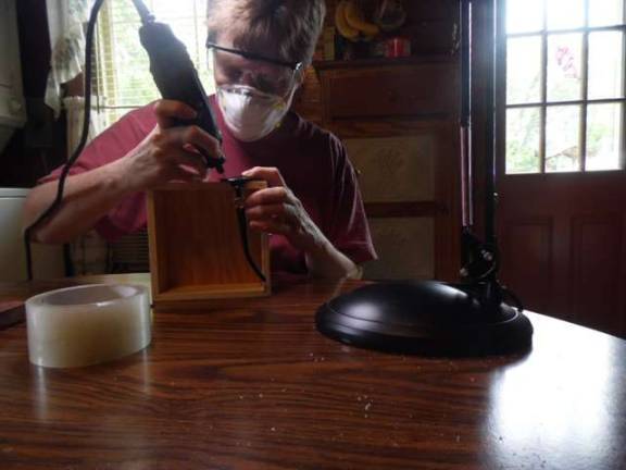 Janis drilling glasses at her mom's house in Arkansas.