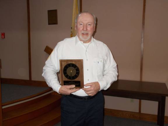 Photos by Vera Olinski Former Wantage Mayor Bill DeBoer receives a plaque recognizing his service on the committee.
