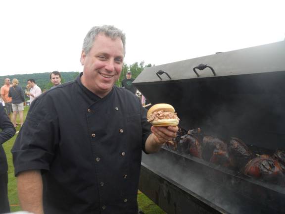 Crystal Spring's Executive Chef Tom Greeley with a pulled pork slider served up to patrons.