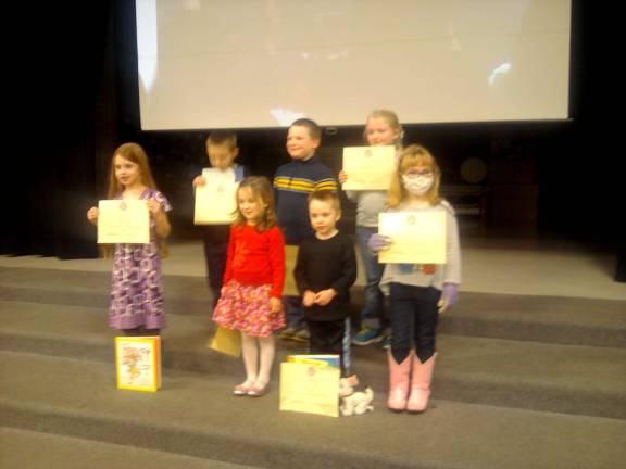 Vernon students read more than 1,000 books to end year Photo by Jennifer Knocha Vernon Township School District students are honored for reading accomplishments in November and December at the Jan. 16 Board of Education meeting.