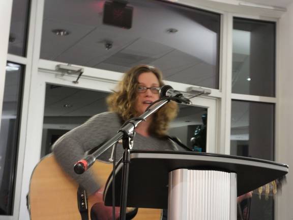 Lights of Life event honors loved ones Soloist Anne Craige sings.