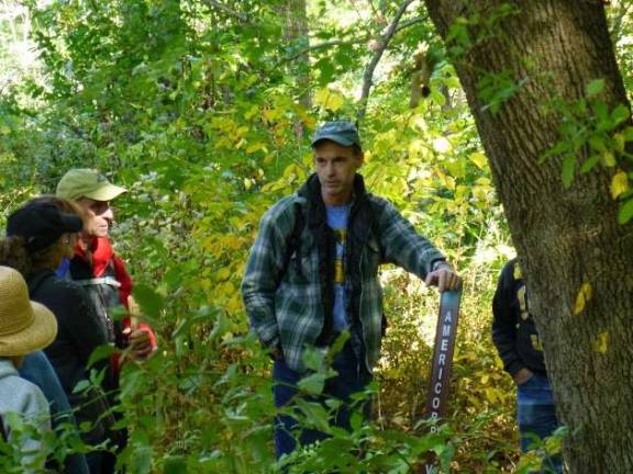 Kevin Mitchell stops to talk about building wildlife shelters on the Autum Leaves Hike.