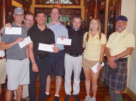 Greg Amerkanian, Brian Sommerville, Bob Jackson, and Darren Amerkanian receive their shared 1st place prizes from GM Mark Meillo &amp; Crystal Springs staffers.