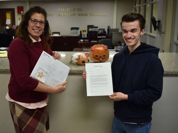 Michael Harris, a senior at Vernon Township High School, recently won a $40,000 scholarship to Monserrat Art College with his sculpture entry at the Mount Olive Art Show. He is shown here with sculpture teacher Lisa Hirkelar.