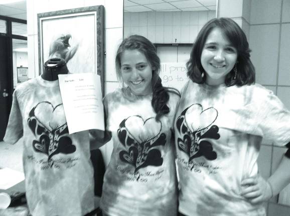 National Honor Society tie dye to raise funds Vernon High School students busy with community service this fall National Honor Society officers Rachel Colvin, secretary, (left) and Kelsey Daly, president, model the tie-dyed tee shirts they are selling to raise money for the Bennett Family medical expenses.