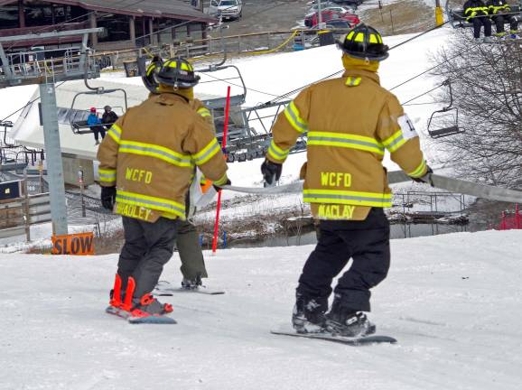 State and local firefighters race for burn center Members of the West Caldwell Fire Department race towards the finish line just above the lodge at Mountain Creek South during the 29th annual New Jersey Firefighters Ski Race on Friday at Mountain Creek Ski Resort in Vernon.