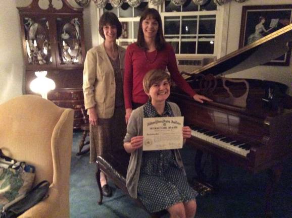 High Point Regional High School senior Becky Turro,seated, is shown with Piano Guild judge Ruthanne Schempf, left, and teacher Dori Martin.