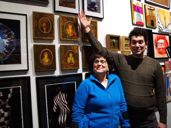 Artist Dawn McLaughlin of the Highland Lakes section of Vernon is shown with Marshall Okin in front of several of her paintings. This series of six individual portraits is part of what she calls &#xfe;&#xc4;&#xfa;Family Album, Depression Era Portraits.&#xfe;&#xc4;&#xf9;