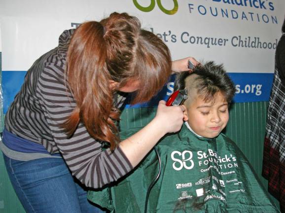 Adrian Guzman, 8, of Stanhope had five sponsors and raised $150 for St. Baldrick&#xfe;&#xc4;&#xf4;s Foundation. His haircutter is Maureen Pezzotta of Prohaircutters of Rockaway.
