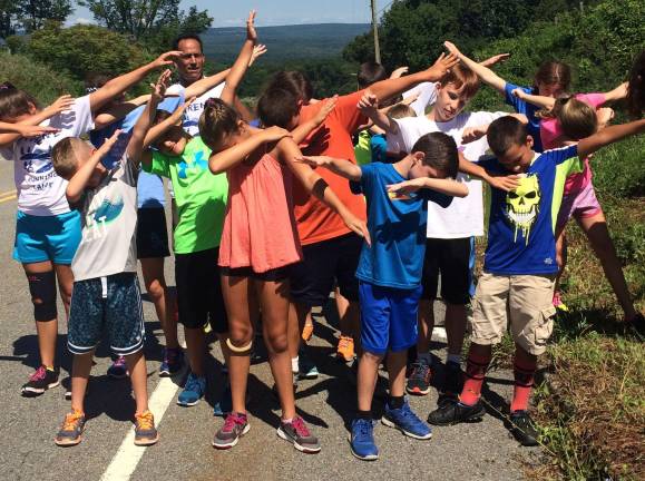 PHOTO BY LAURIE GORDONLast year's X-Treme Youth Running Camp. A &quot;dab&quot; at the top of Fredon Hill after the kids ran to the top