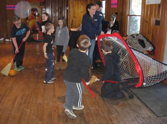 Highland Lakes hosts winter carnival Broom hockey is popular at the winter carnival.