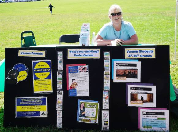 Rebecca Dorney of Vernon Coalition covers the Center for Prevention and Counseling table.
