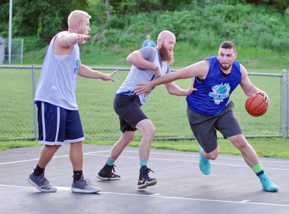 Team Smalley wins summer basketball league Team Tobin's Elvis Hodzic handles the ball.