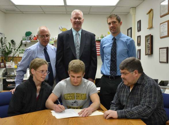 Andrew Forino of Vernon Township High School signs his Letter of Intent to swim at Alderson Broaddus University. Seated from left, Arlene Forino, Andrew and his father, Vincent. Standing from left,athletic director Bill Edelman, Principal Tim Dunnigan and head swim coach Doug Miller.
