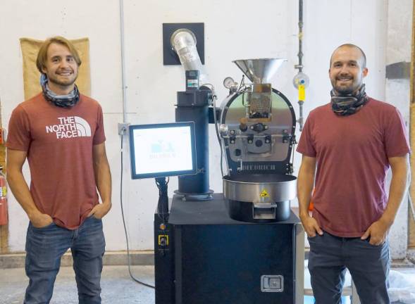 Coffee is serious business at Brother Beans Tyler (left) and Alex Correll with their coffee bean roaster. Photos by Vera Olinski.