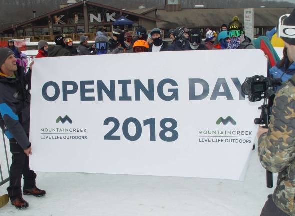 Mountain Creek&#x2019;s John Matusiewicz, Adventure Manager and Cheryl Swift hold Opening Day Banner.