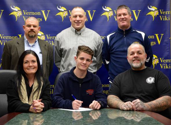 Wrestler signs letter to wrestle in college Standing left to right: Assistant Coach John Loggie, Head Coach Todd Piontkowski and Athletic Director Bill Foley.Seated left to right: Mrs. Germinario, Sergio and Mr. Germinario